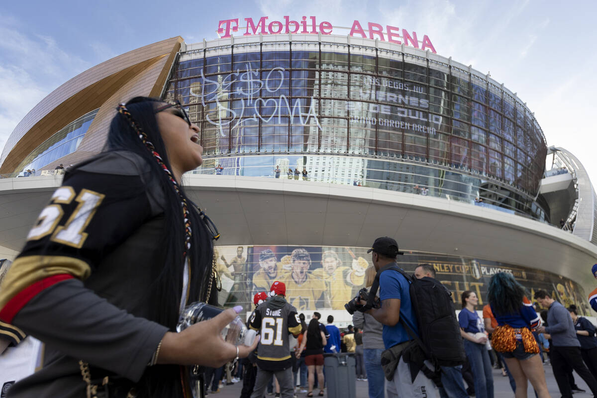A Golden Knights fan cheers outside T-Mobile Arena before Game 1 of an NHL hockey Stanley Cup s ...
