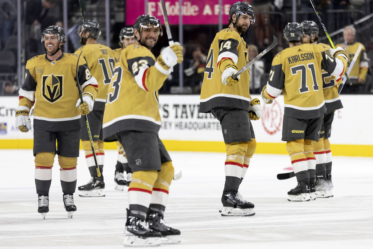 The Golden Knights celebrate after winning Game 1 of an NHL hockey Stanley Cup second-round pla ...