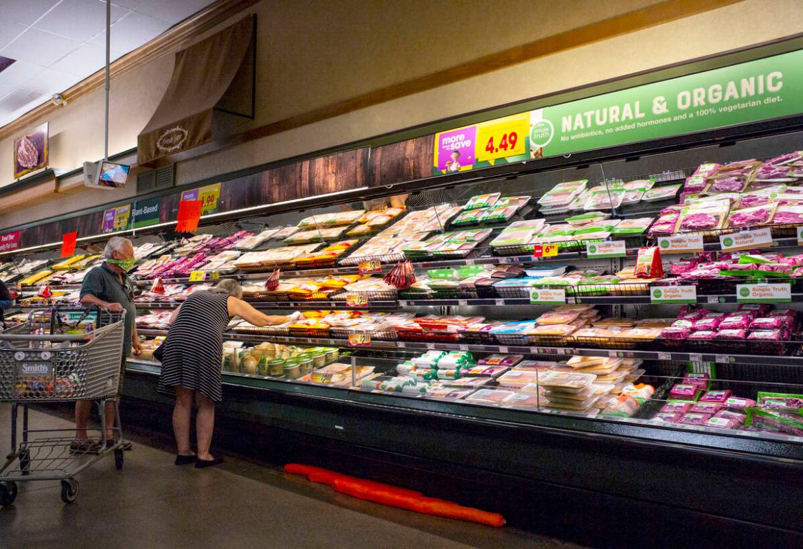 People shop for groceries at Smith's Meat Market in Las Vegas on Saturday, May 2, 2020.  (Ch...