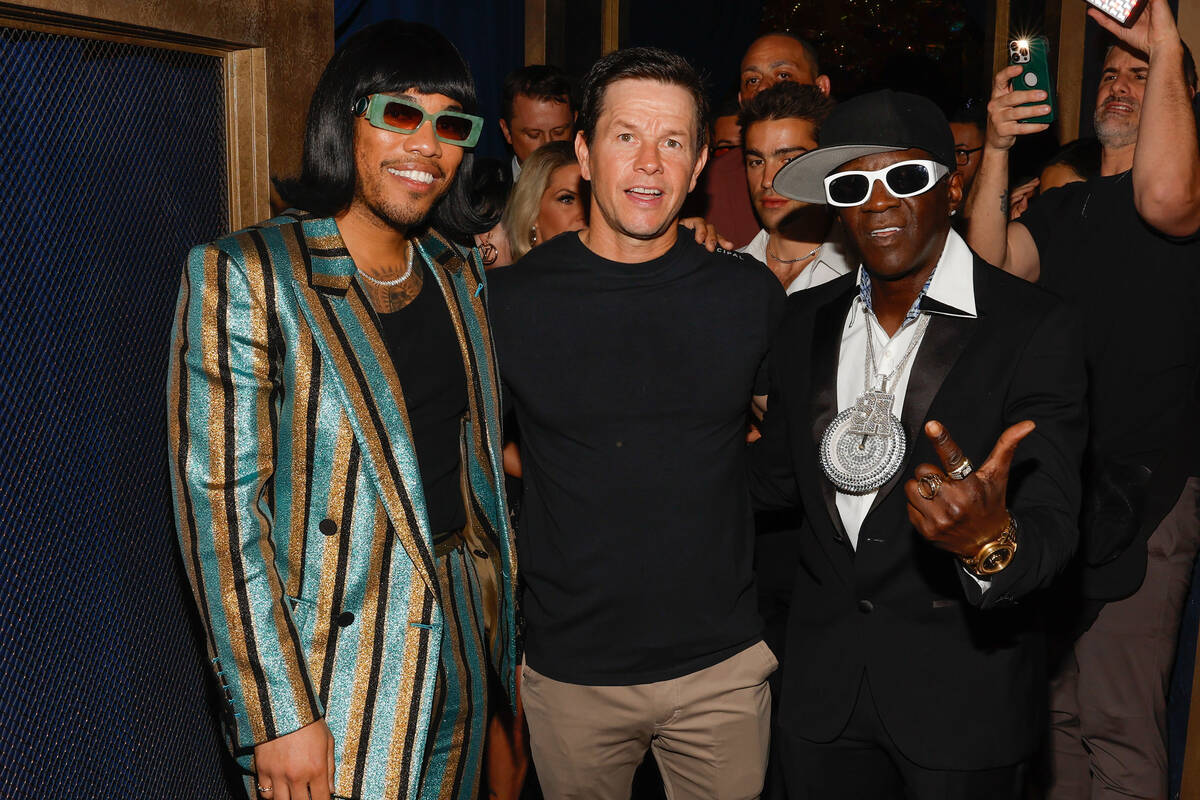 Actor Mark Wahlberg, center, with Anderson .Paak (left) and Flavor Flav attend the grand openin ...