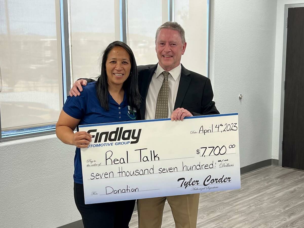 Sheree Corniel, the founder of Real Talk, poses with Tyler Corder, CFO of Findlay Automotive, w ...