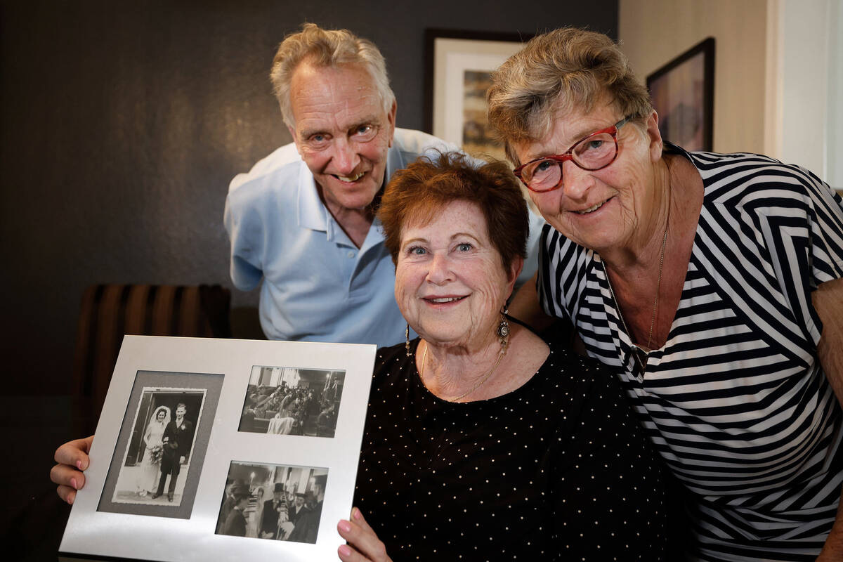 Ann-Marja Lander, center, poses for a photo with Carla de Reus-Kreb of the Netherlands, right, ...