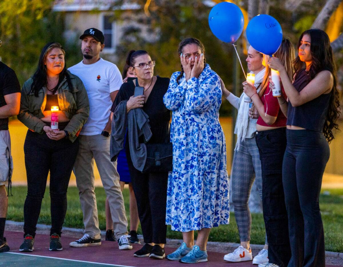 Maria Regina Lacerda Gomes, center, is overcome with the outpouring of love for her daughter Ta ...