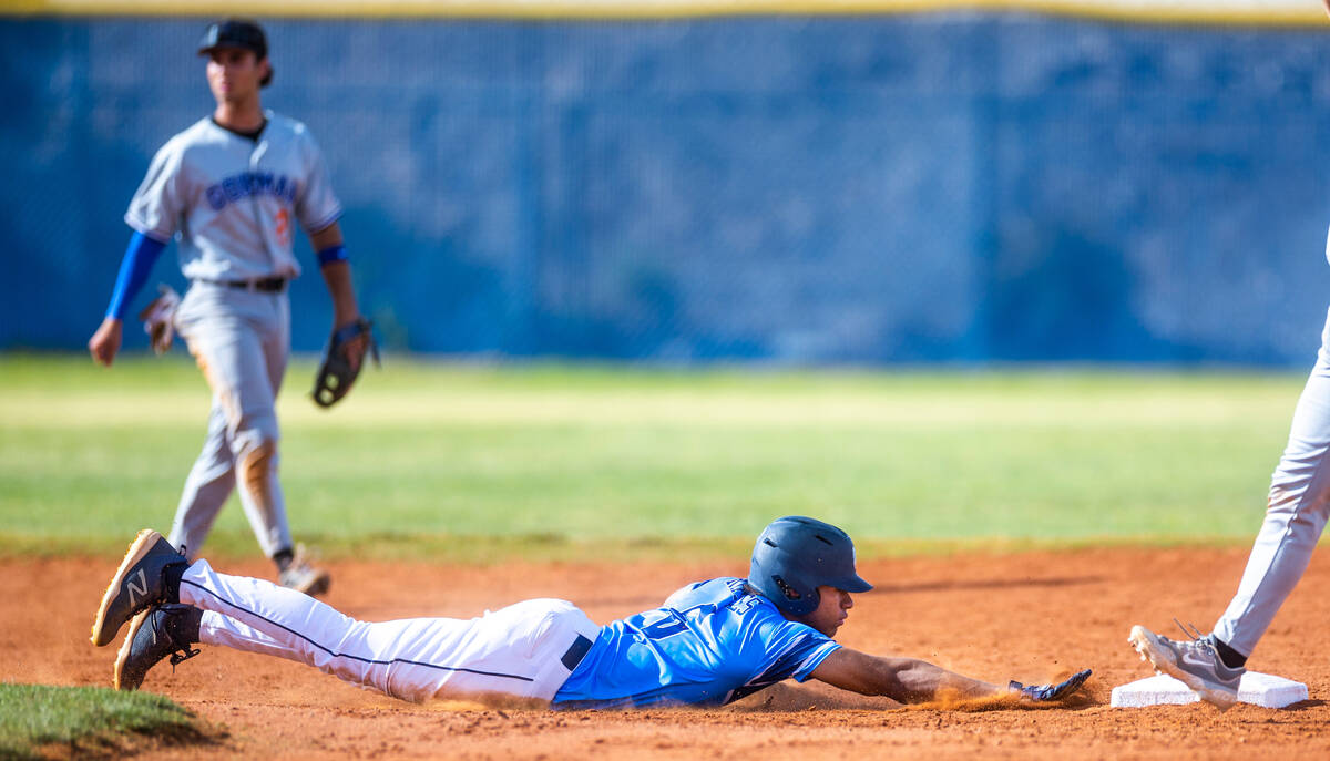 Centennial runner Alex Rhynes (6) dives safely back to second base against Bishop Gorman during ...
