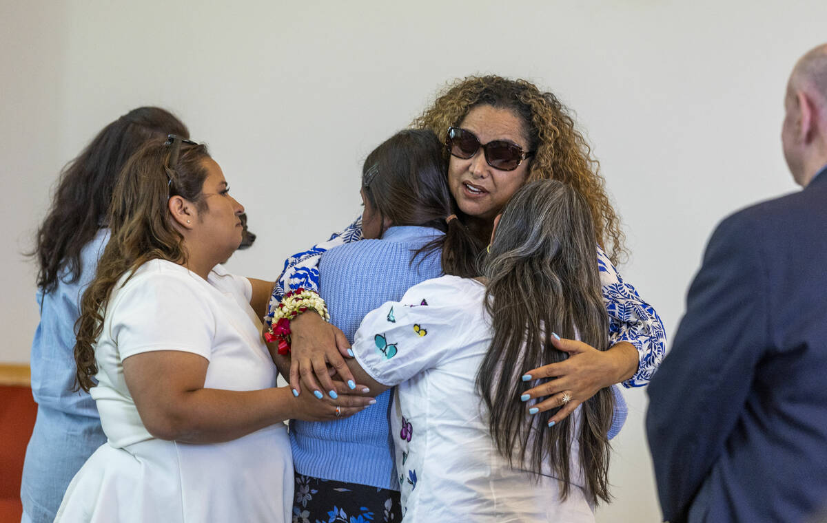 Mom Regina Lacerda, center, is comforted during a funeral for her daughter Tabatha Tozzi at Pal ...