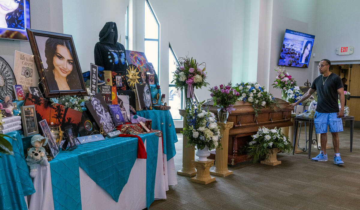 A mourner says his goodbyes during a funeral for Tabatha Tozzi at Palms Northwest Mortuary on W ...