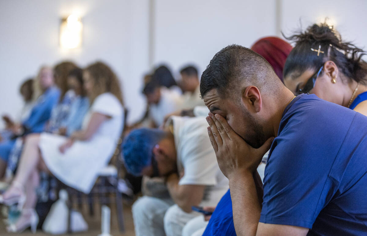 Mourners become emotional during a funeral for Tabatha Tozzi at Palms Northwest Mortuary on Wed ...