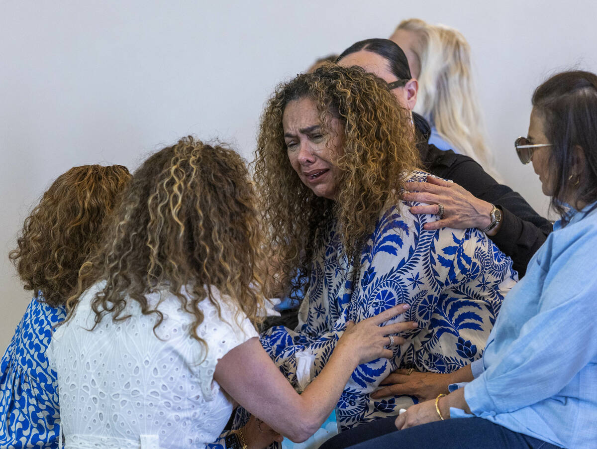 Mom Regina Lacerda, center, is comforted during a funeral for her daughter Tabatha Tozzi at Pal ...