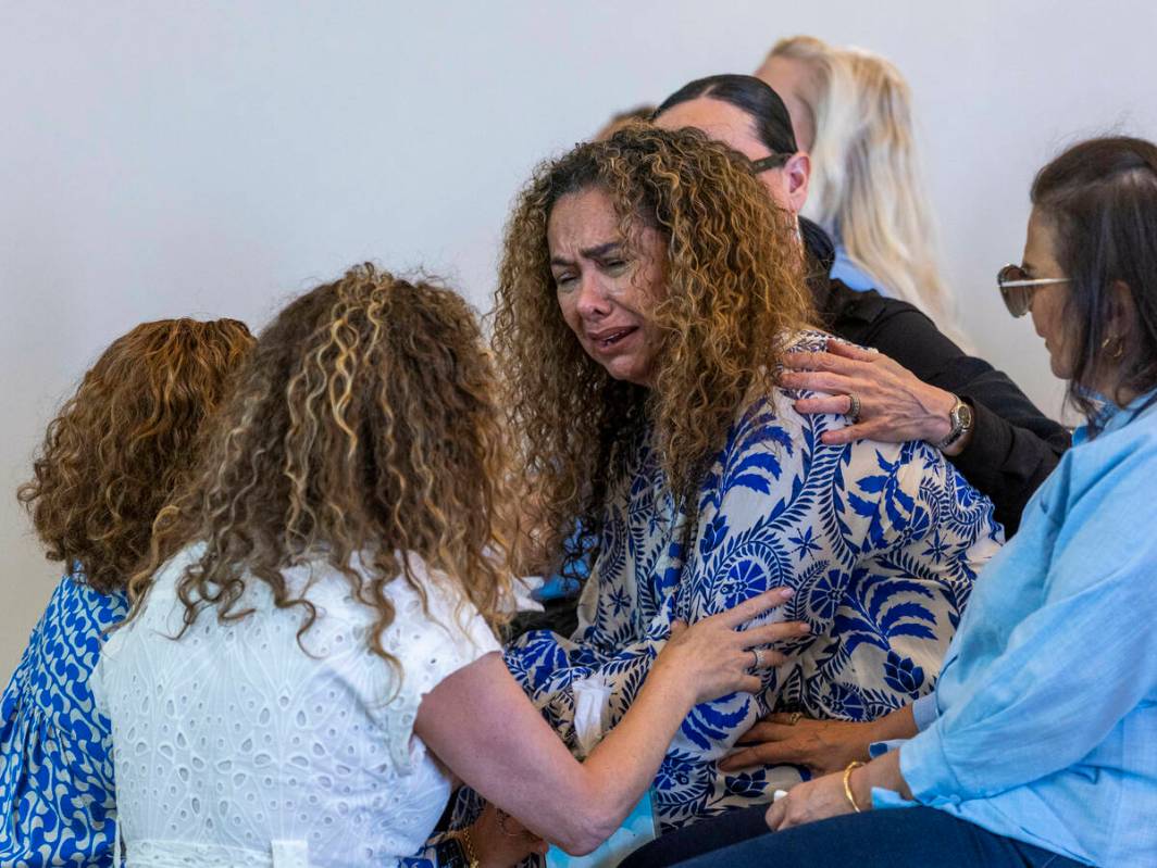 Mom Regina Lacerda, center, is comforted during a funeral for her daughter Tabatha Tozzi at Pal ...