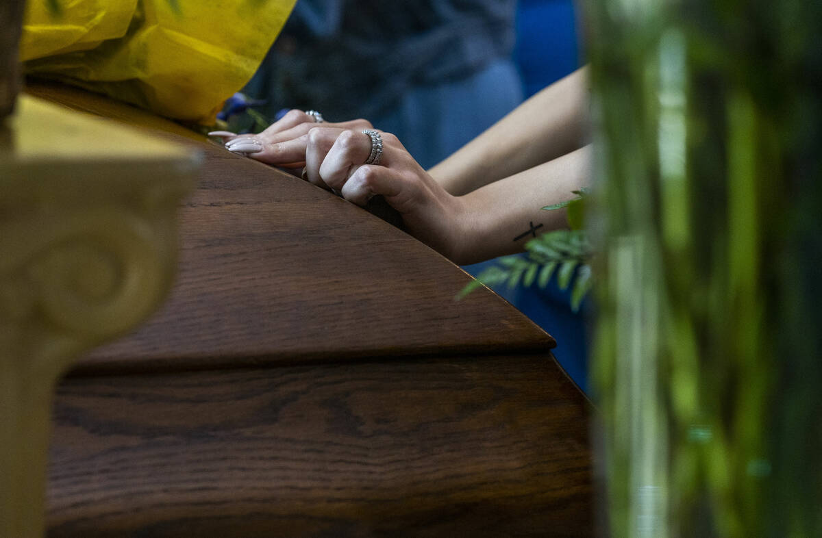 A mourner says her final goodbyes during a funeral service for Tabatha Tozzi at Palms Northwest ...