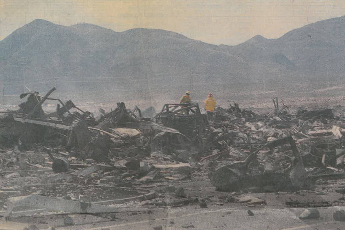 Firefighters walk amid twisted steel beams Thursday, May 5, 1988, at the PEPCON site. (Las Vega ...