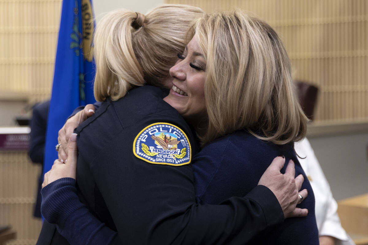 Police chief Hollie Chadwick hugs Mayor Michelle Romero, right, after her swearing-in ceremony ...
