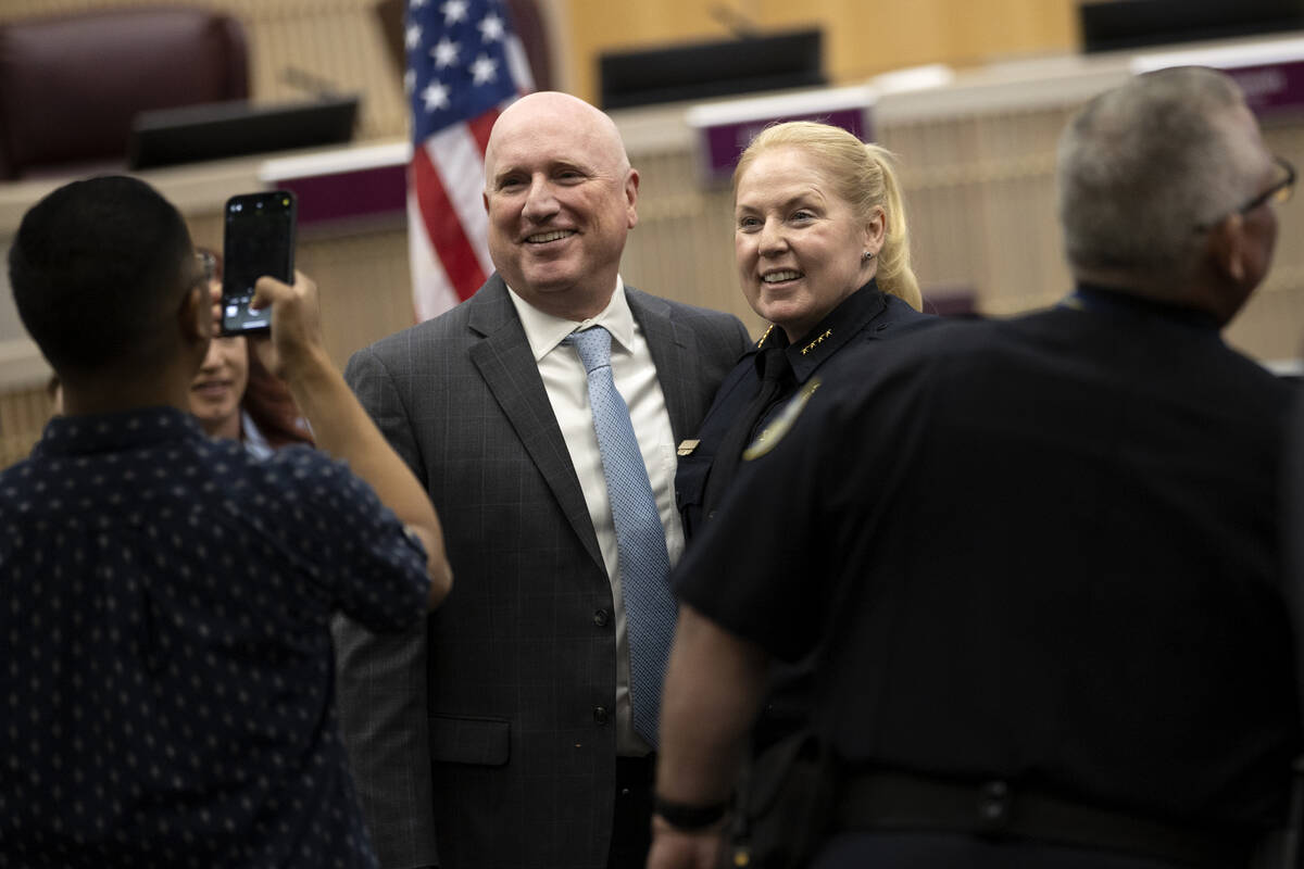 Police chief Hollie Chadwick, right, poses for a photo with Jim McIntosh, Henderson chief finan ...