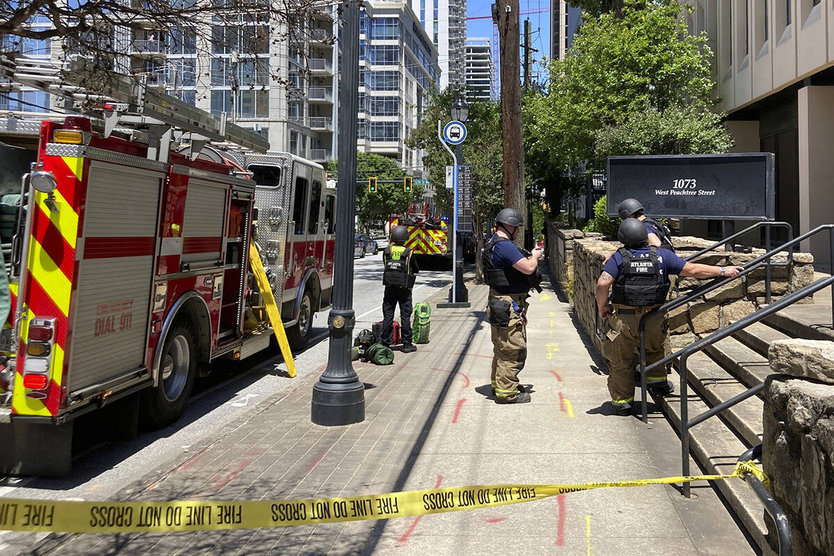 Emergency personnel respond to the scene of active shooting in Atlanta on Wednesday, May 3, 202 ...