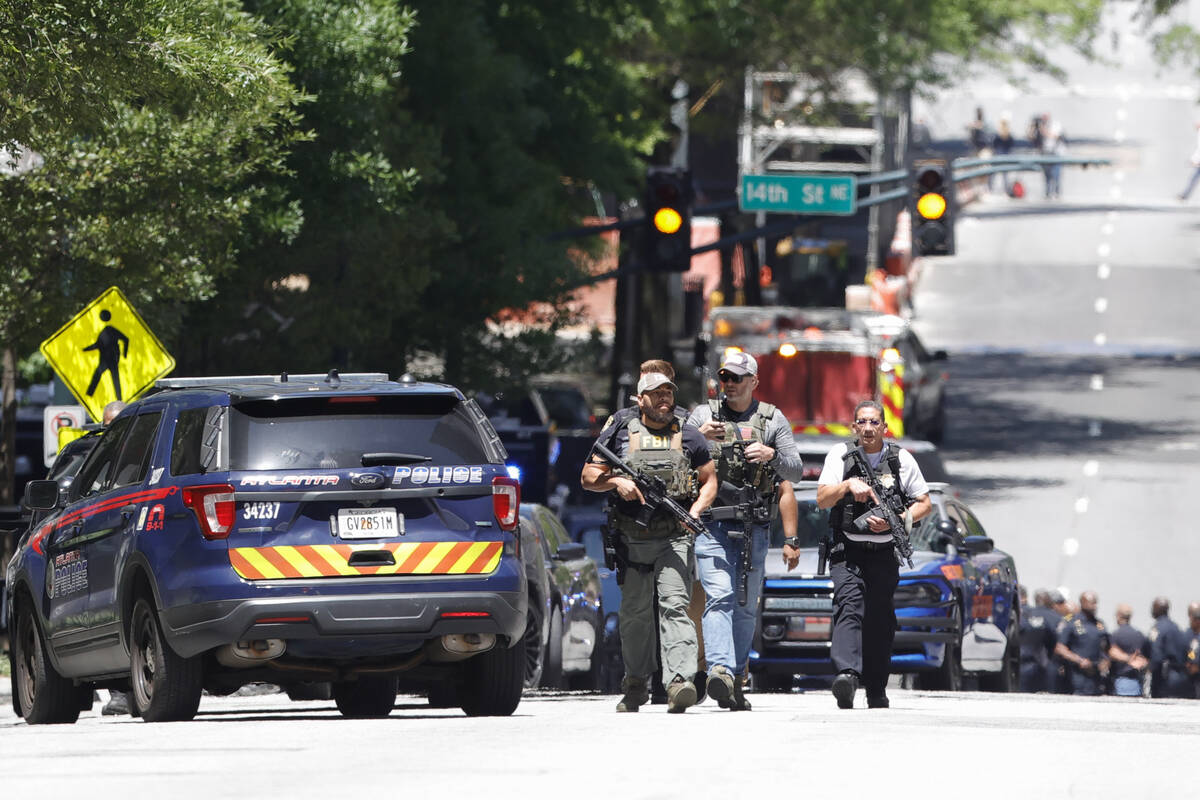 Law enforcement officers arrive near the scene of an active shooter on Wednesday, May 3, 2023 i ...