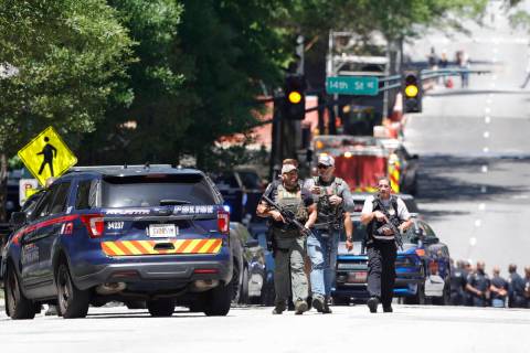 Law enforcement officers arrive near the scene of an active shooter on Wednesday, May 3, 2023 i ...