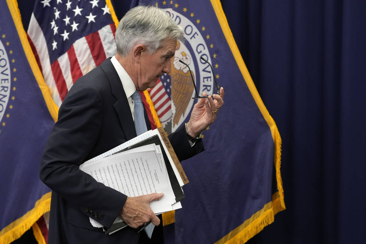File - Federal Reserve Board Chair Jerome Powell walks from the podium after speaking at a news ...