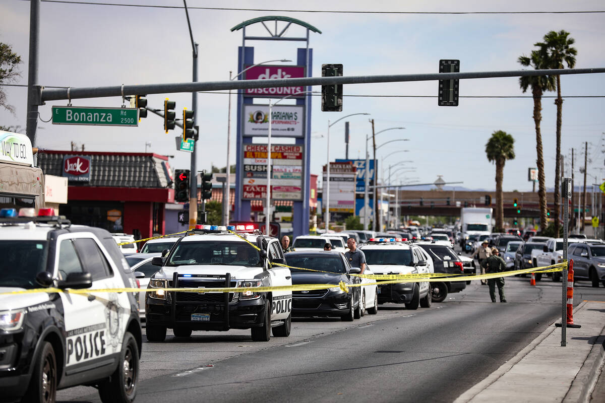 Police at the scene where at least one person was injured after a shooting in central Las Vegas ...