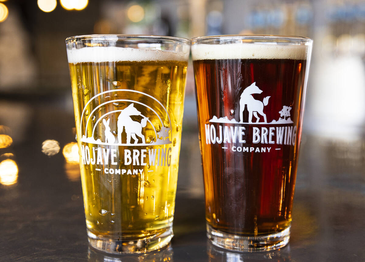 Pint glasses filled with Rubby Soho, left, and Red 5, Irish Red Aie, are displayed at Mojave Br ...