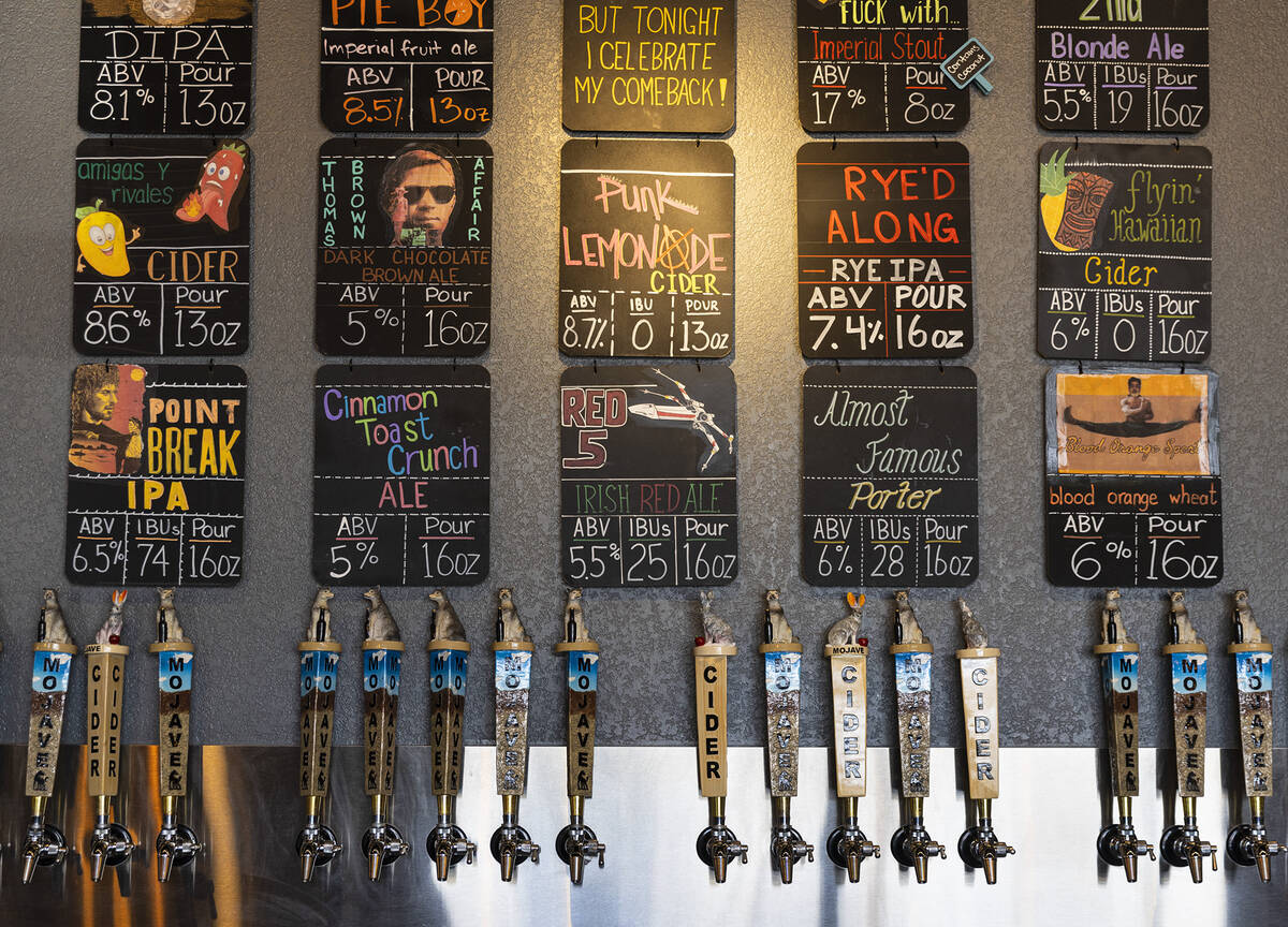 Beers on tap are listed at Mojave Brewing on Wednesday, March 29, 2023, in Henderson. (Bizuayeh ...