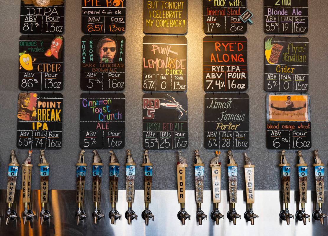 Beers on tap are listed at Mojave Brewing on Wednesday, March 29, 2023, in Henderson. (Bizuayeh ...