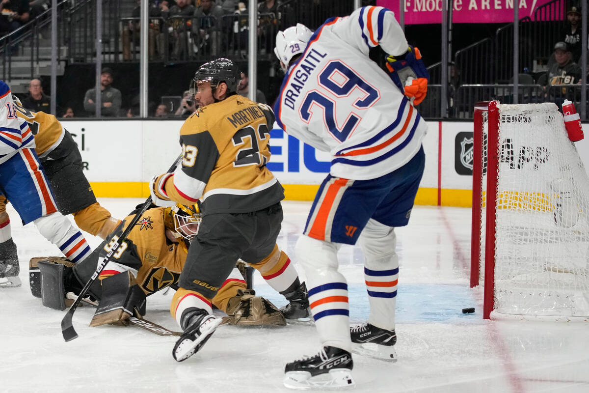 Edmonton Oilers center Leon Draisaitl (29) scores against Vegas Golden Knights goaltender Laure ...