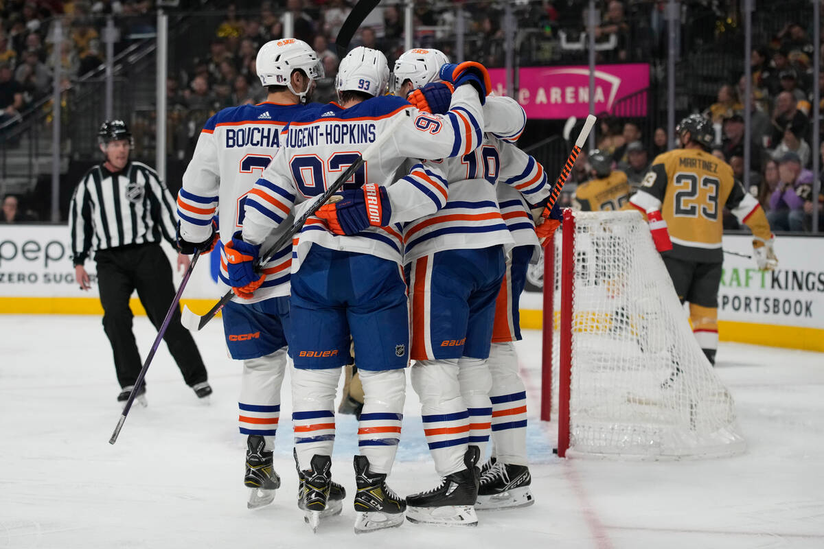 Edmonton Oilers players celebrate after Edmonton Oilers center Leon Draisaitl (29) scored again ...