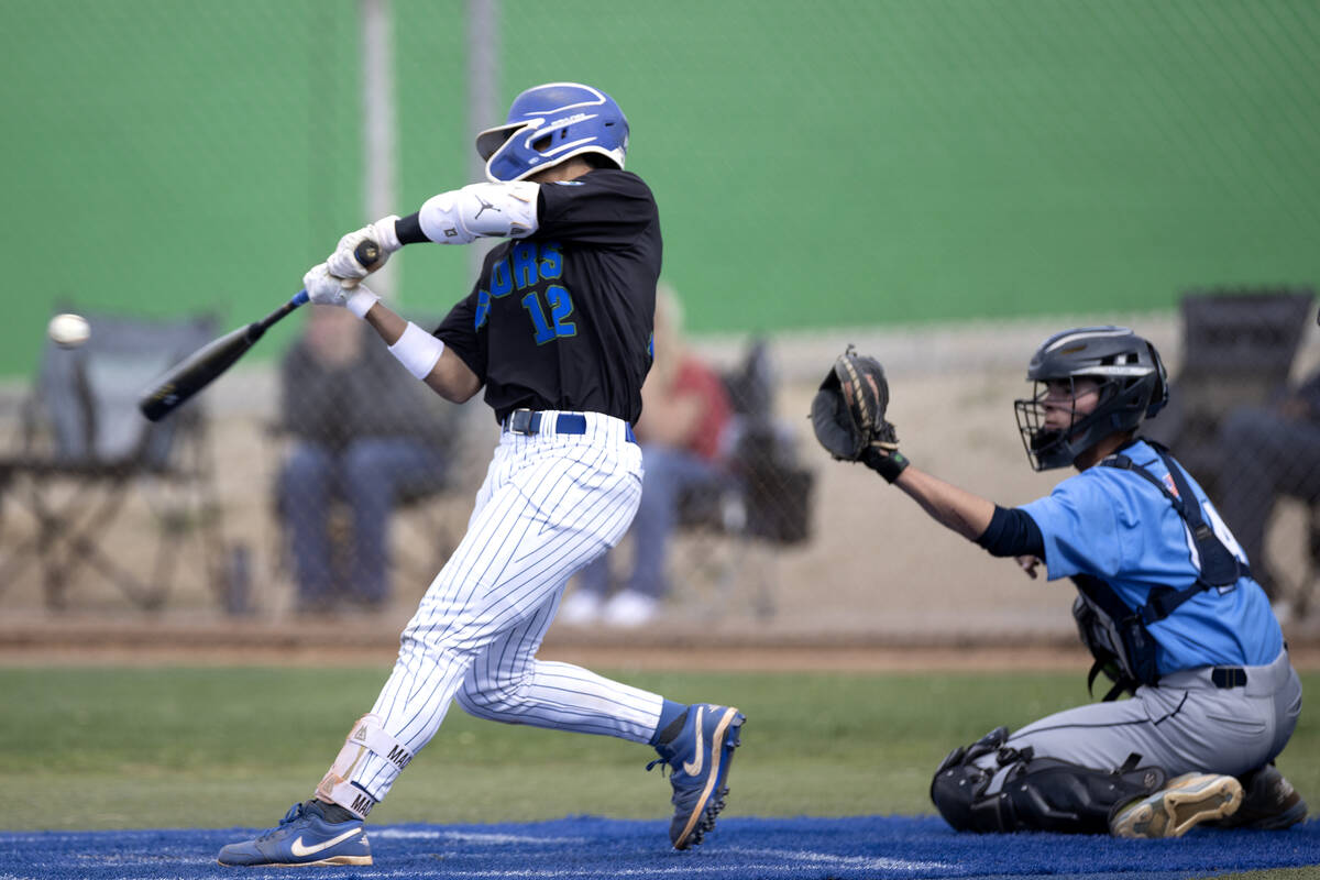 Green Valley’s Caden Kirby bats for a homer against Centennial during a high school base ...