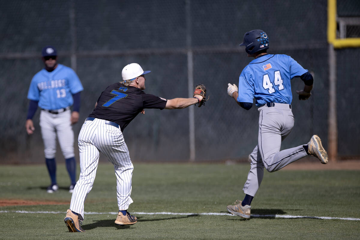 Green Valley’s Brady Ballinger (7) reaches to tag Green Valley’s Tyler Jackson ou ...