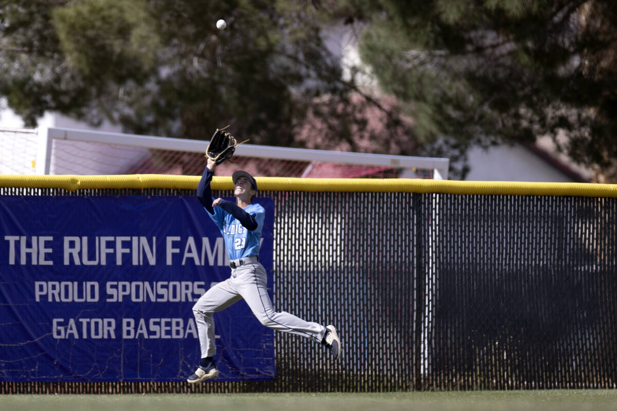 Centennial outfielder Brady Oliver jumps to catch for an out on Green Valley during a high scho ...