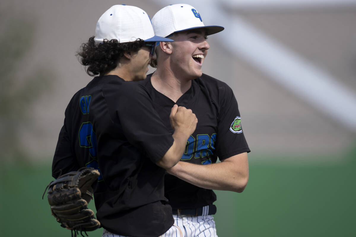 Green Valley shortstop Jacob Ferry and pitcher Brady Ballinger after Ferry caught a ball to end ...