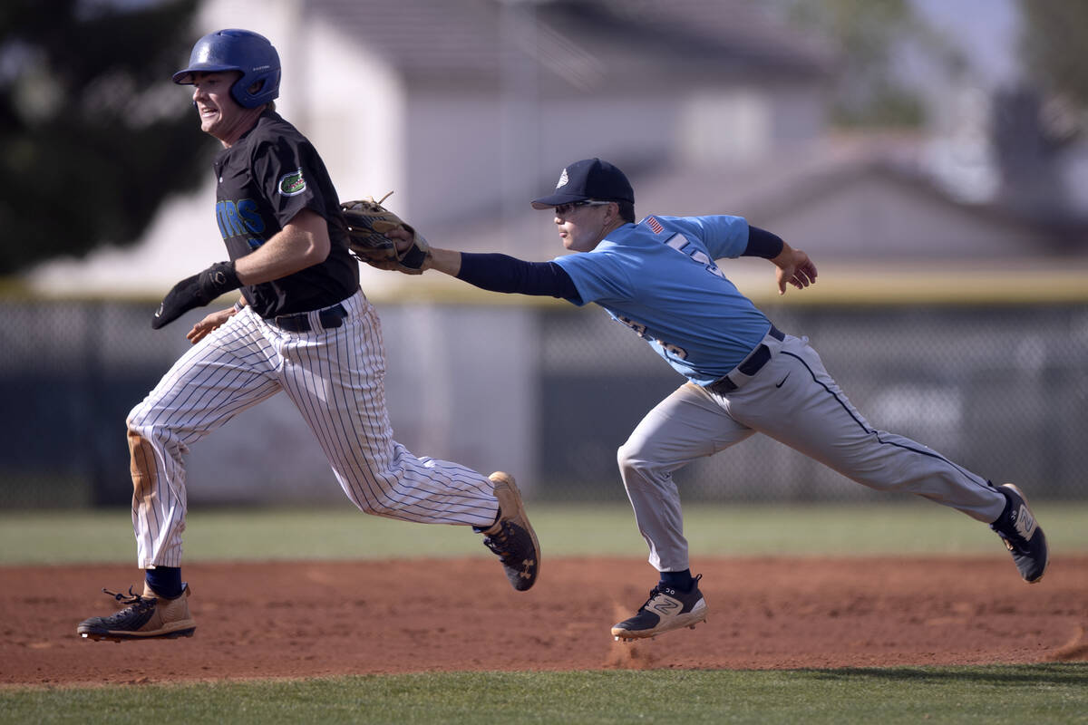 Centennial’s Noa Oyadomari reaches to tag Green Valley’s Brady Ballinger out afte ...