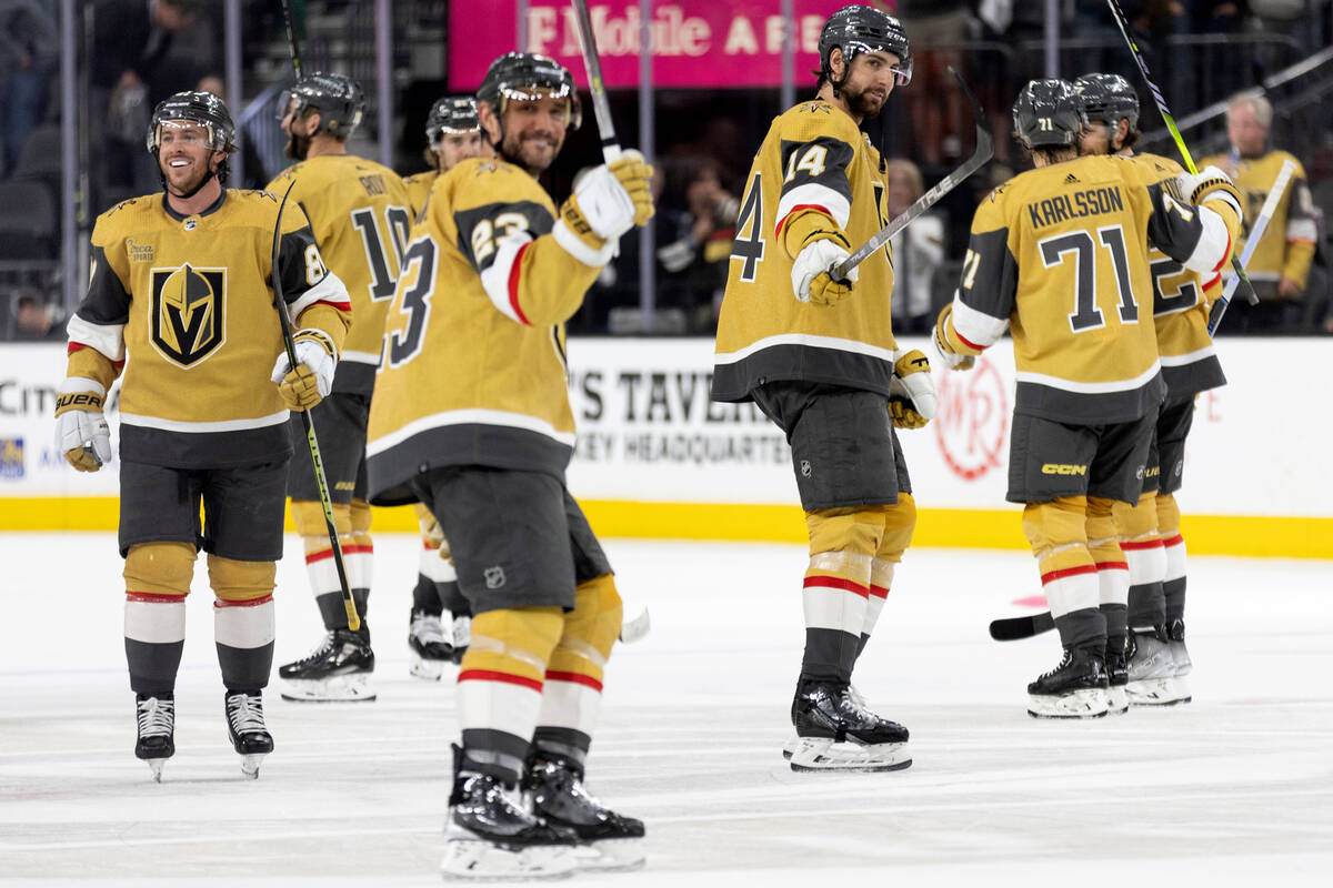 The Golden Knights celebrate after winning Game 1 of an NHL hockey Stanley Cup second-round pla ...