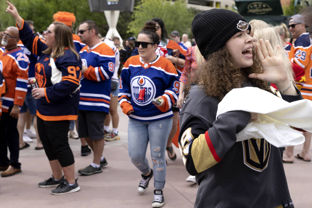 Maya Ames, 16, cheers for the Golden Knights to counter a sea of Edmonton Oilers fans cheering ...