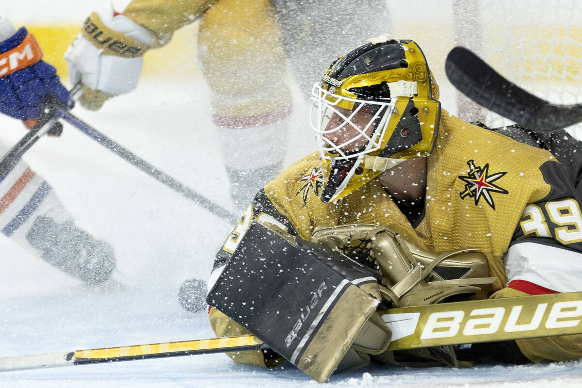 Golden Knights goaltender Laurent Brossoit (39) saves the puck during the second period in Game ...