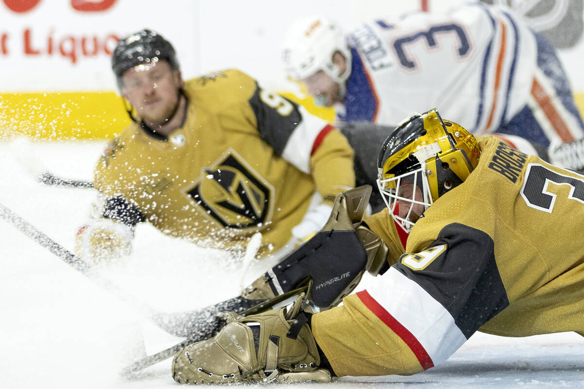 Golden Knights goaltender Laurent Brossoit (39) dives to save during the second period in Game ...