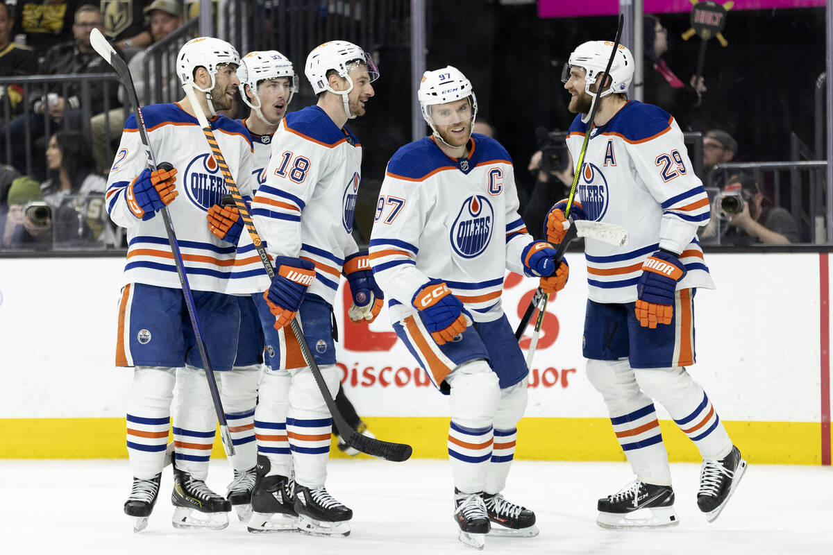 The Edmonton Oilers celebrate after scoring during the second period in Game 2 of an NHL hockey ...