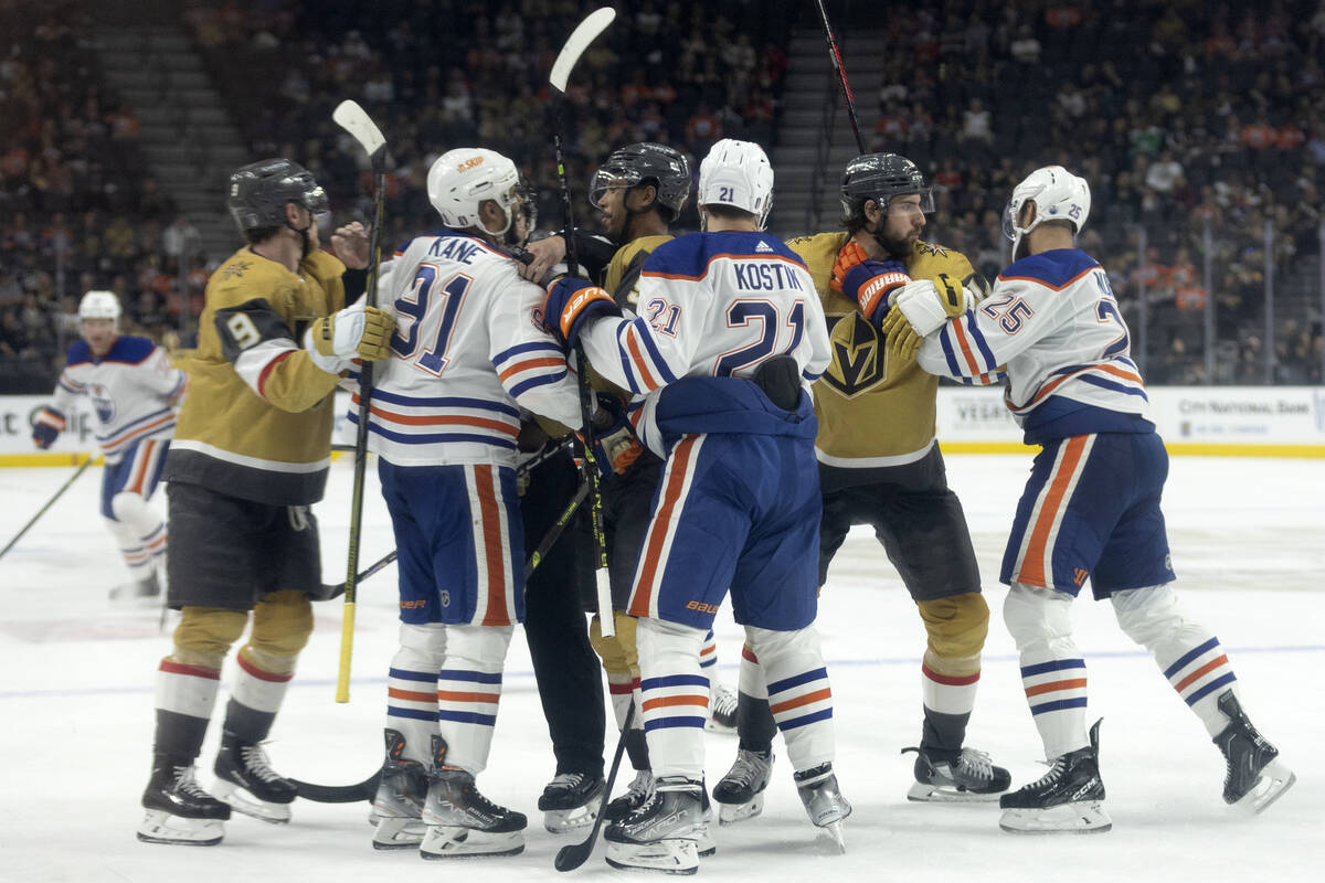 The Golden Knights fight with the Edmonton Oilers during the third period in Game 2 of an NHL h ...