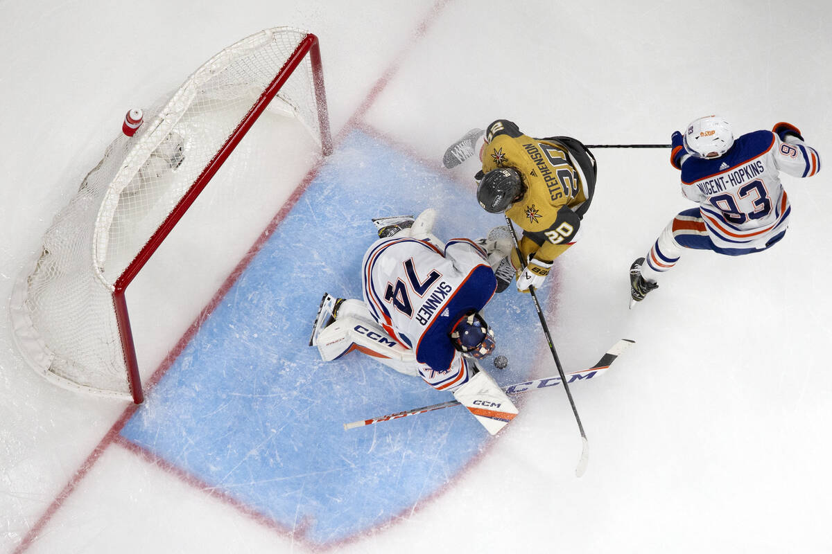 Edmonton Oilers goaltender Stuart Skinner (74) saves while Golden Knights center Chandler Steph ...