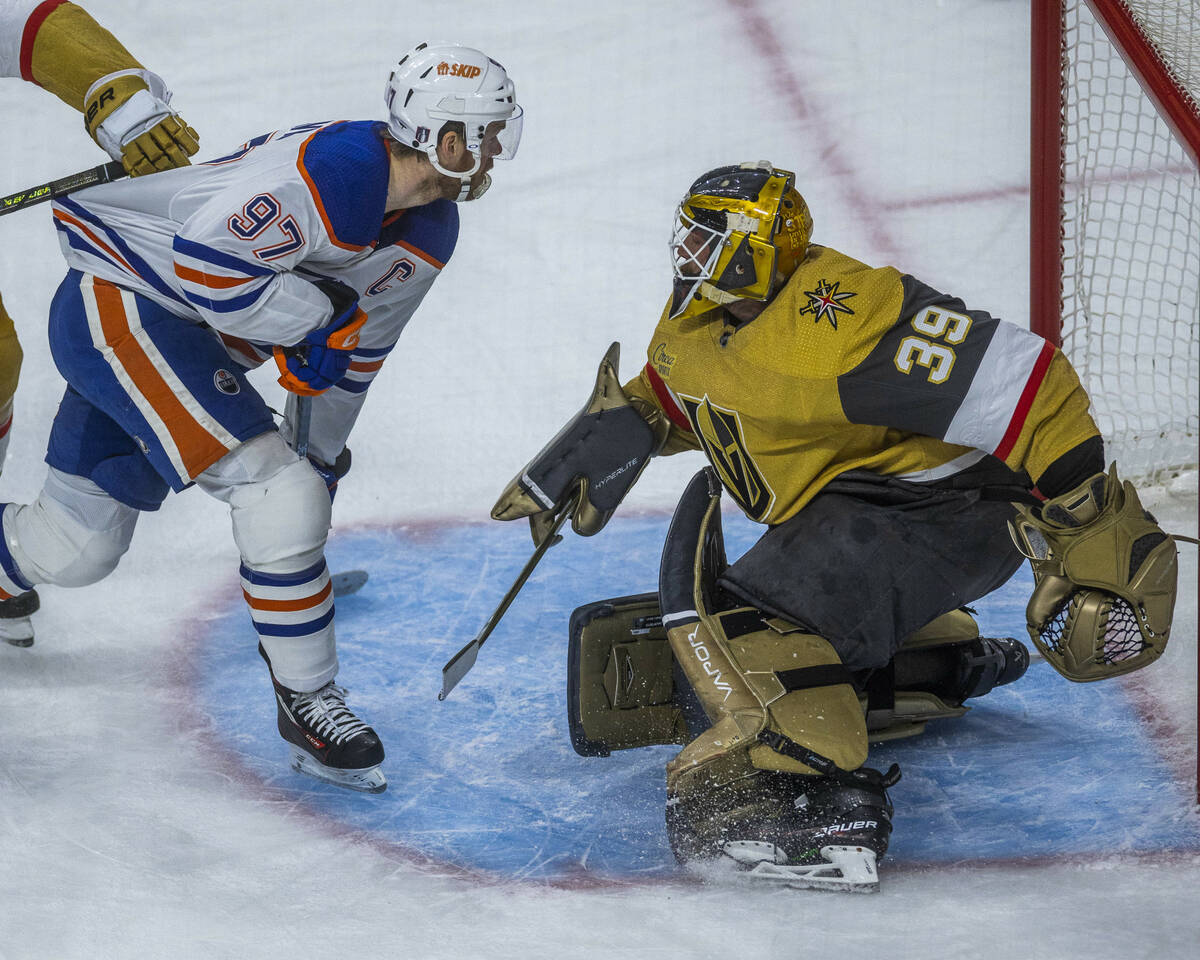 Edmonton Oilers center Connor McDavid (97) scores on Golden Knights goaltender Laurent Brossoit ...