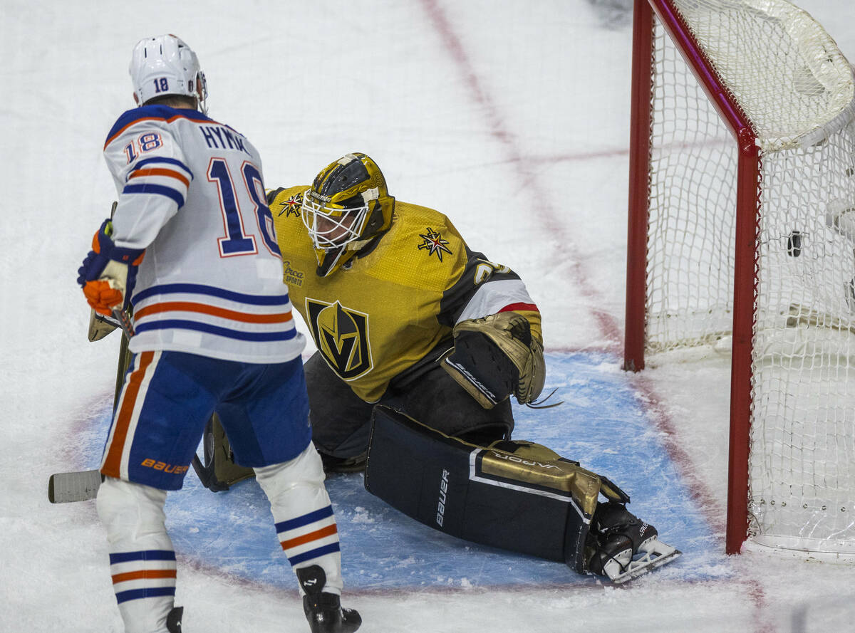Edmonton Oilers left wing Zach Hyman (18) scores on Golden Knights goaltender Laurent Brossoit ...