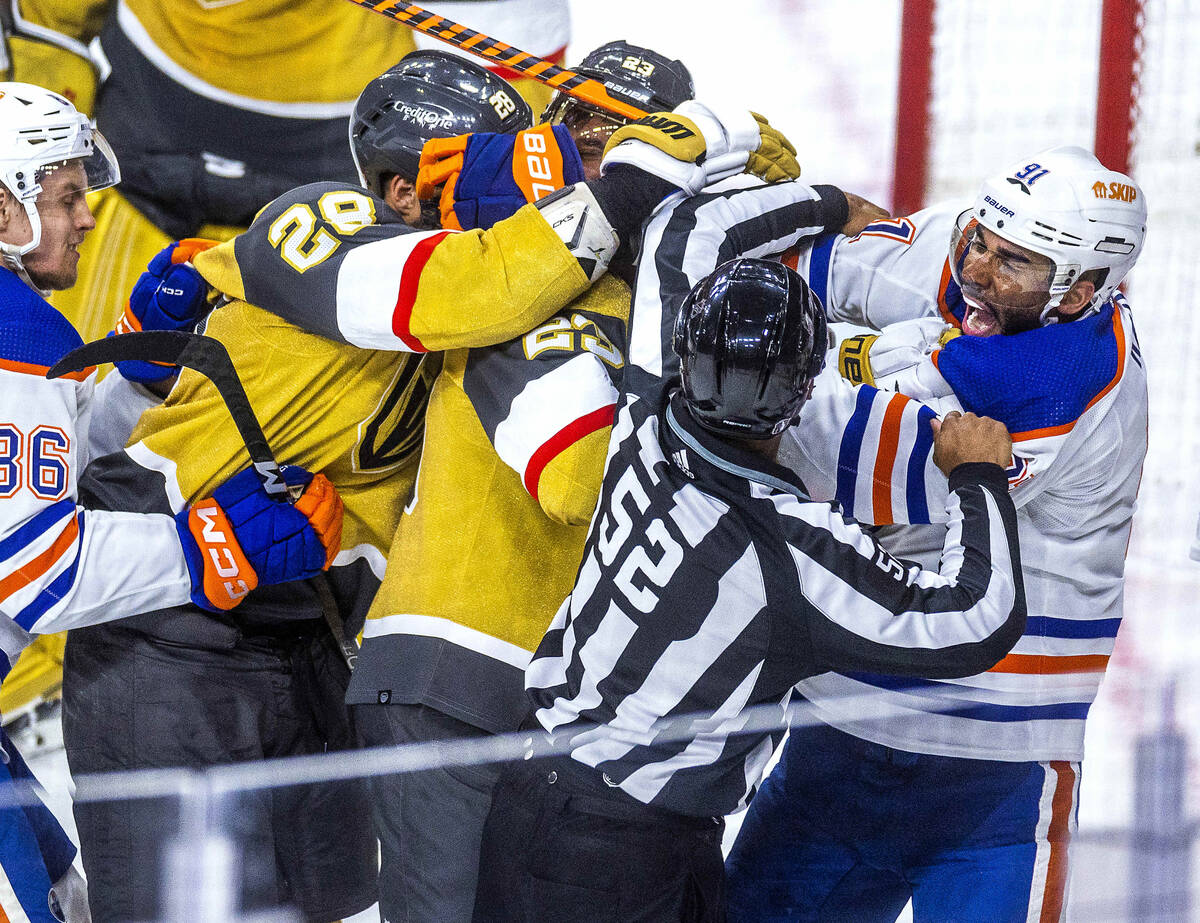 Edmonton Oilers left wing Evander Kane (91) yells out as he tangles with a referee and Golden K ...