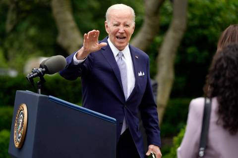 President Joe Biden waves after speaking in the Rose Garden of the White House in Washington, M ...