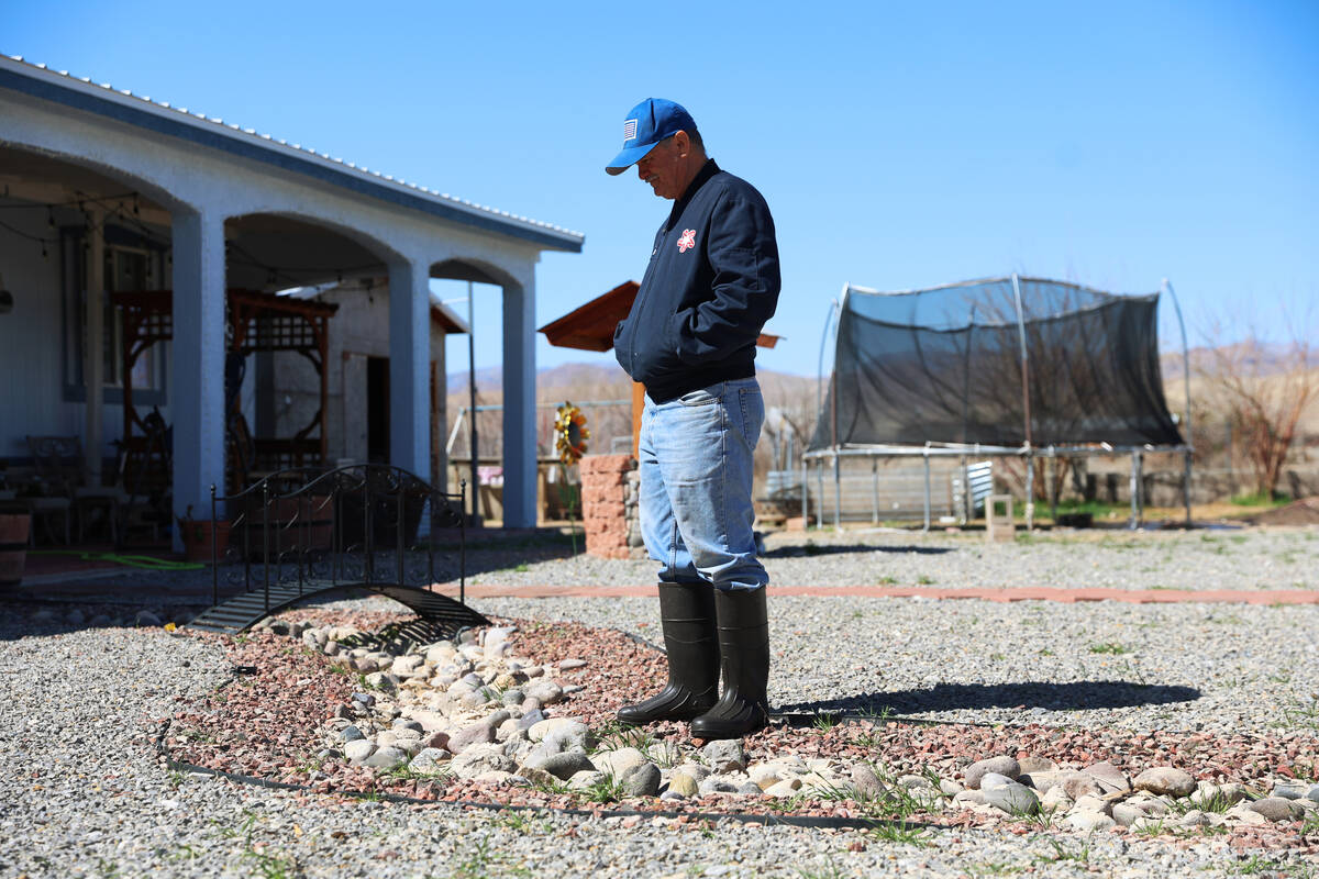 Mario Perez stands outside of his home in the Lytle Ranch neighborhood in Moapa, Nev., Thursday ...