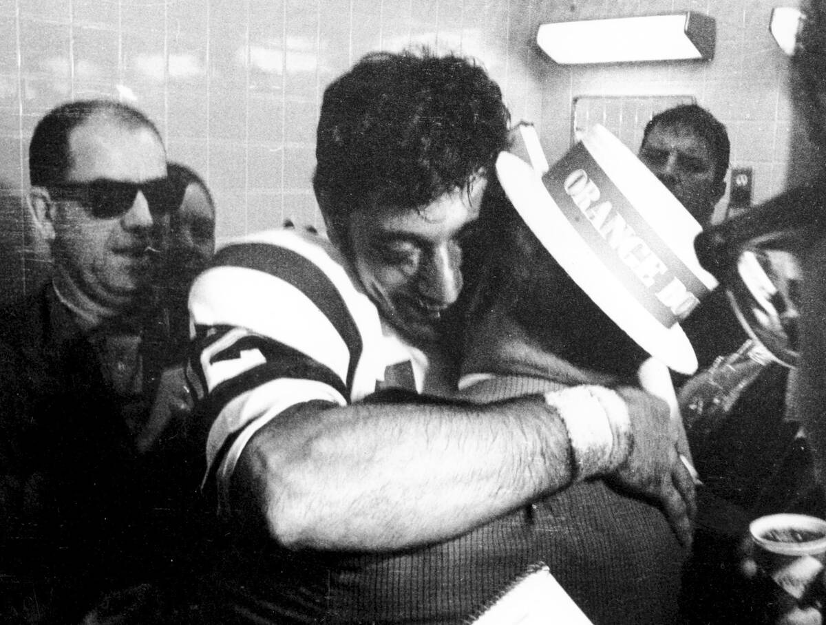 FILE - In this Jan. 12, 1969, file photo, New York Jets quarterback Joe Namath gives his father ...