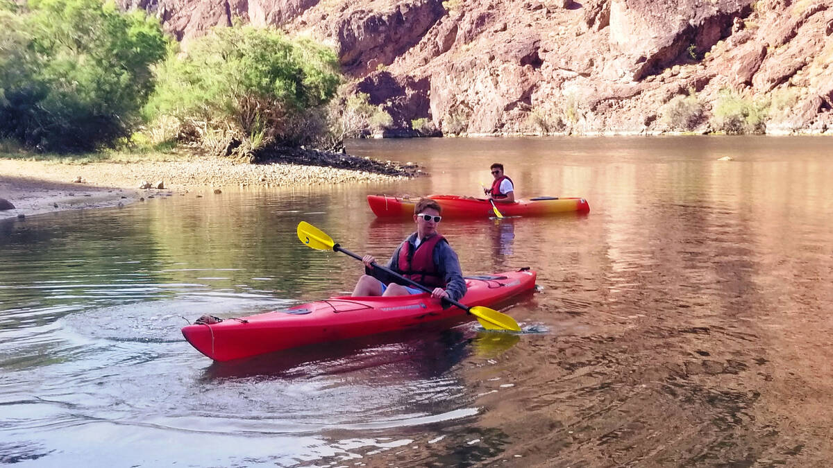Ryan Burt and Will West take a break along an Arizona beach on the Black Canyon National Water ...
