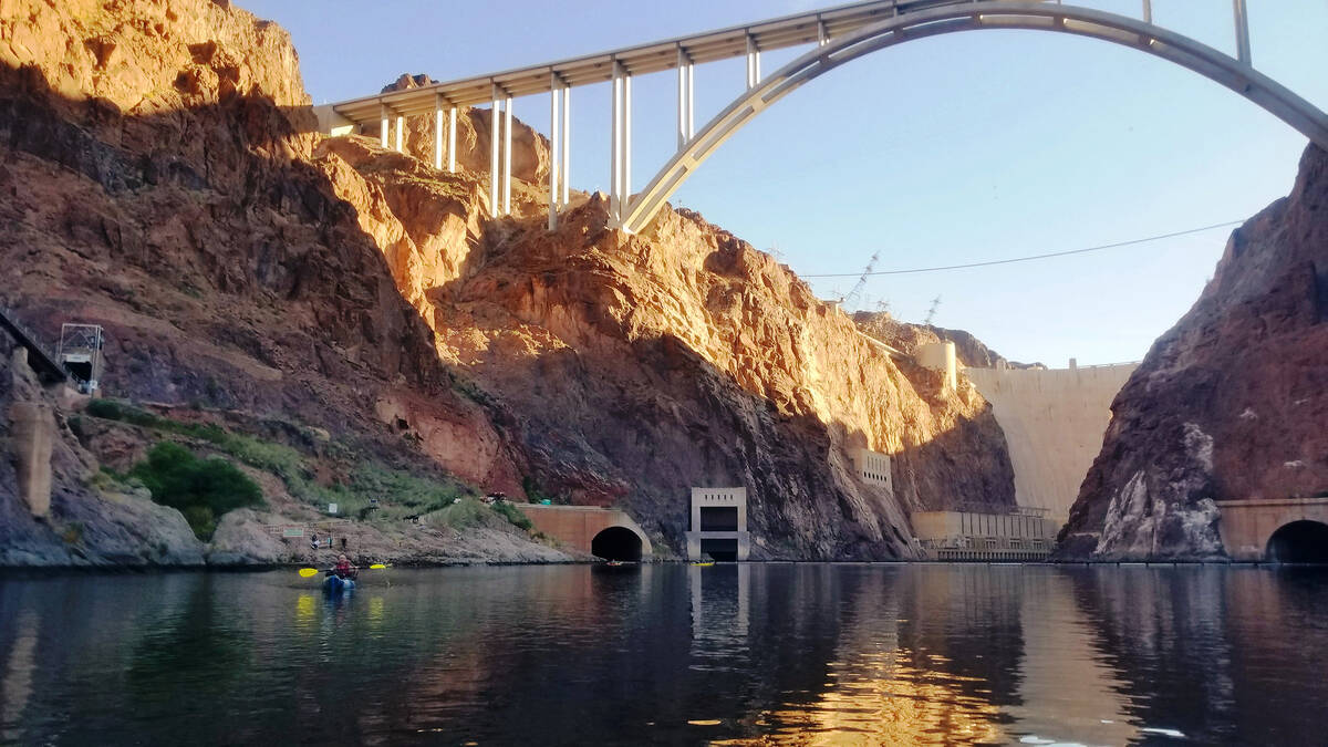 Kayakers enjoy calm waters near Hoover Dam at the start of an 11-mile Lower Colorado River padd ...