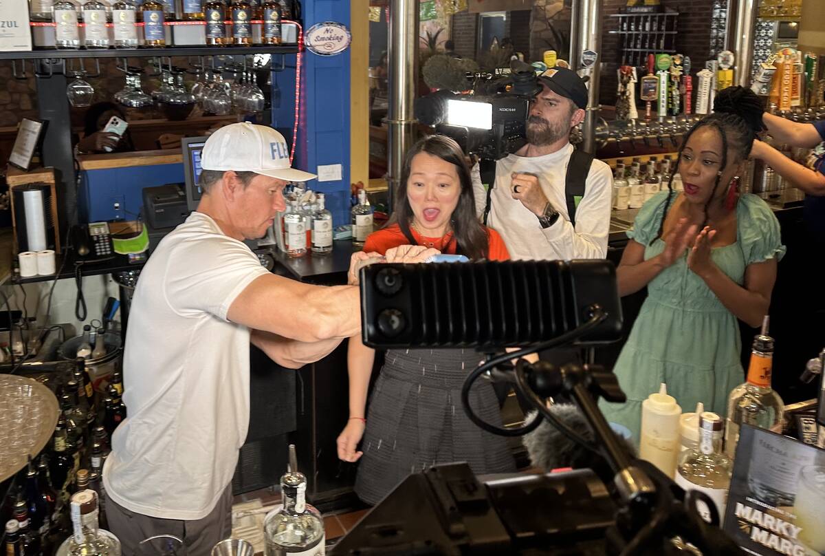 Mark Wahlberg tends bar and pours Flecha Azul tequila shots during an appearance alongside On T ...