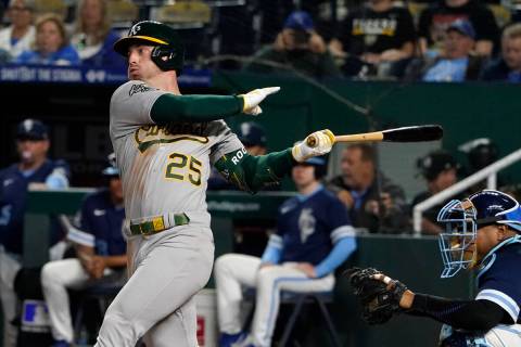 Oakland Athletics' Brent Rooker hits a single in the eighth inning during a baseball game again ...