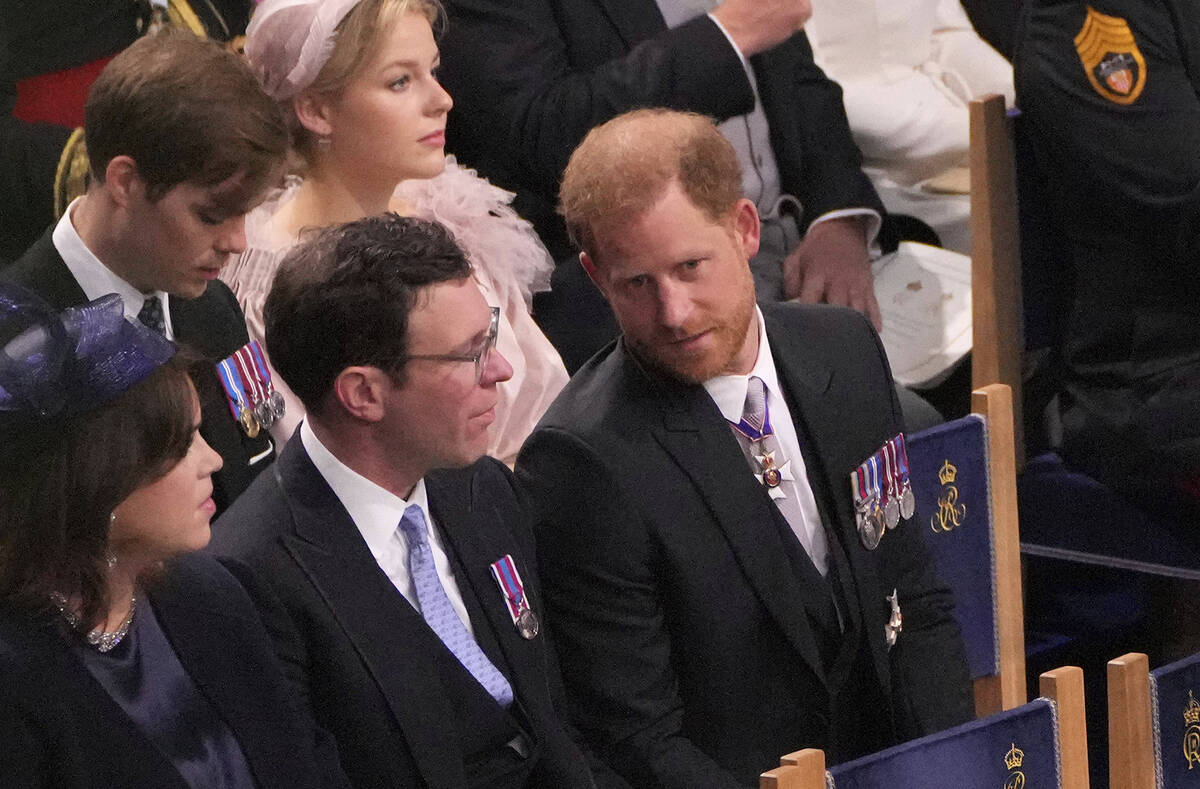 From left, Princess Eugenie, Jack Brooksbank and Britain's Prince Harry attend the coronation c ...